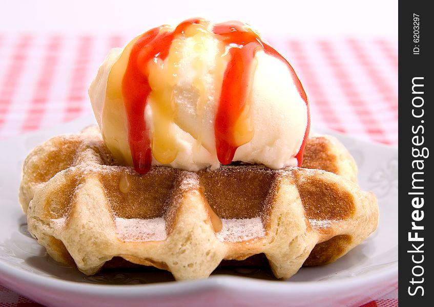 Waffle with vanilla ice cream and strawbarry coating