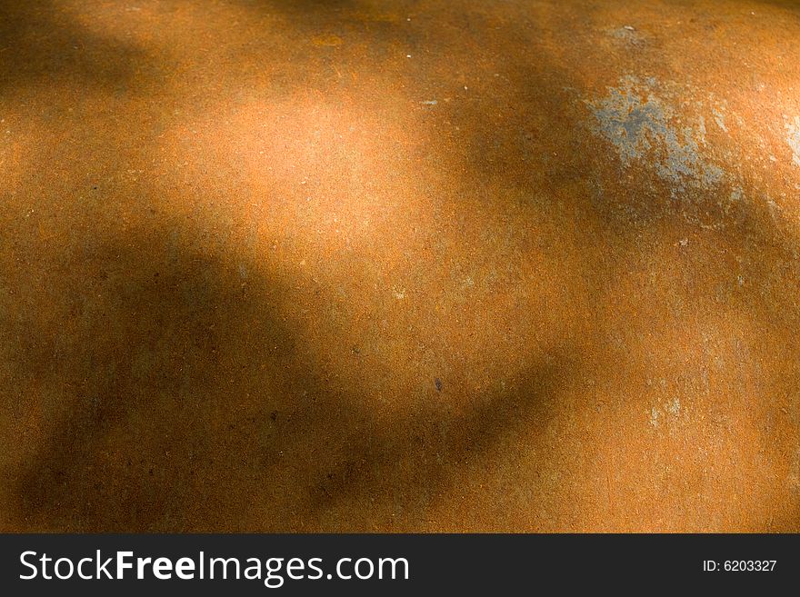 Rusty iron surface with shadows. Background texture.