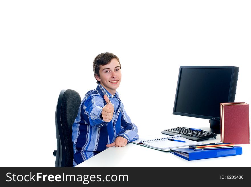 Teenager student doing homework with computer and books on desk, white background