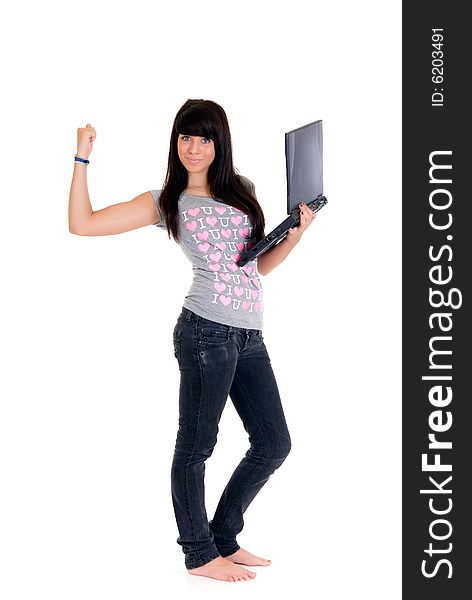 Teenager schoolgirl with laptop on white background