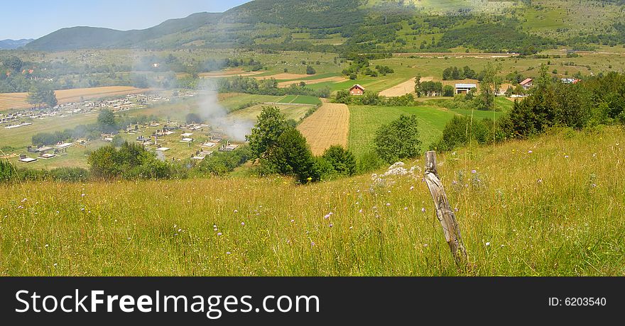 Panorama of the rural countryside village, graveyard and fields in remote area *panoramic image of 2 horizontal images stitched together. Panorama of the rural countryside village, graveyard and fields in remote area *panoramic image of 2 horizontal images stitched together