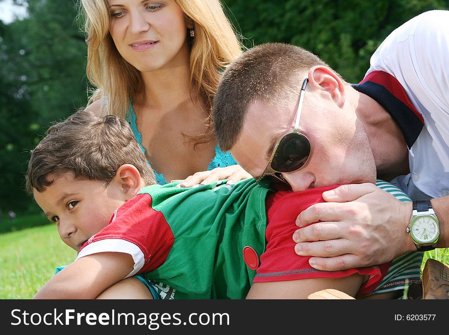 Happy family walking in park. Happy family walking in park