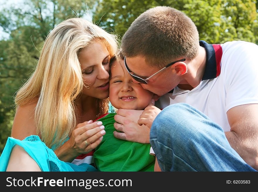 Happy family walking in park. Happy family walking in park