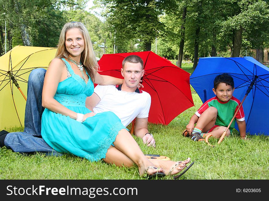 Happy family walking in park. Happy family walking in park