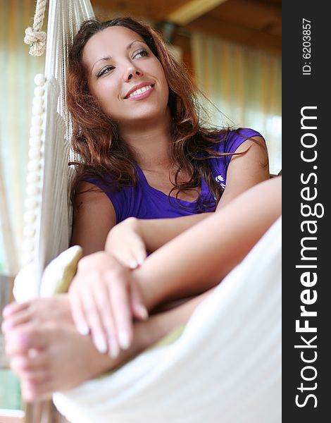 Beautyful long-haired girl relaxing in hammock. Beautyful long-haired girl relaxing in hammock