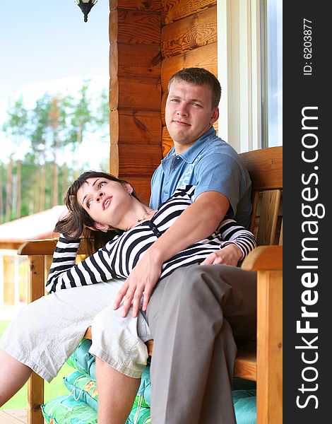 Young couple ralaxing in summer cottage. Young couple ralaxing in summer cottage