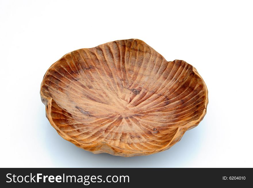 Shot of a wooden bowl on a white background