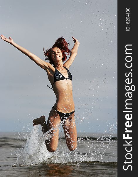 Funny young girl having fun on the sea. Funny young girl having fun on the sea