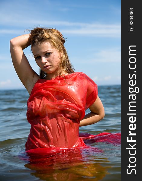 Beautiful Girl Swimming With Red Shawl