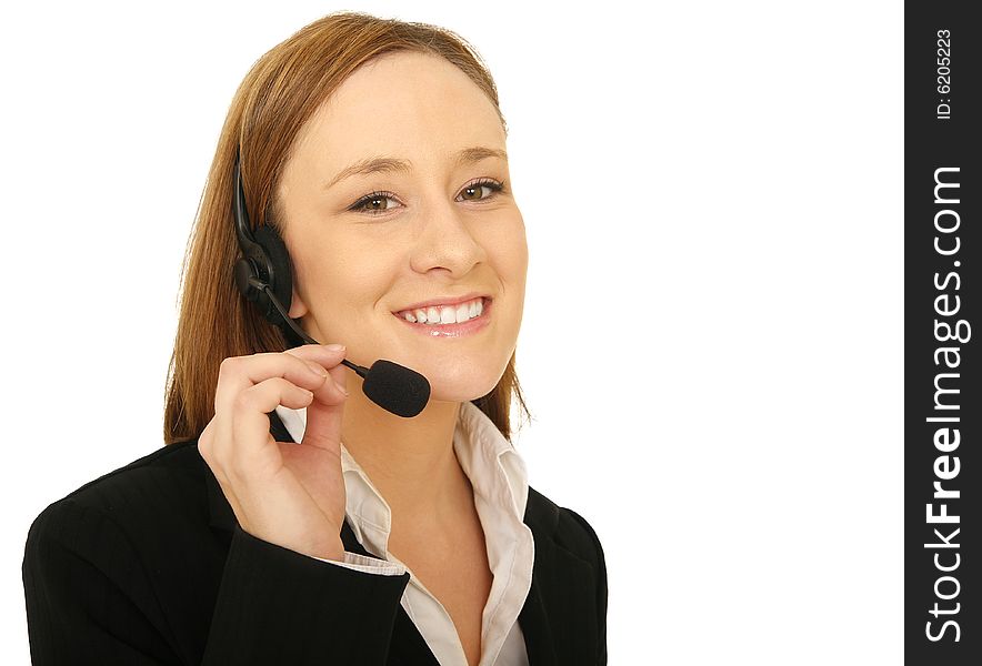 Close up shot of young business woman wearing headset and holding it. Close up shot of young business woman wearing headset and holding it