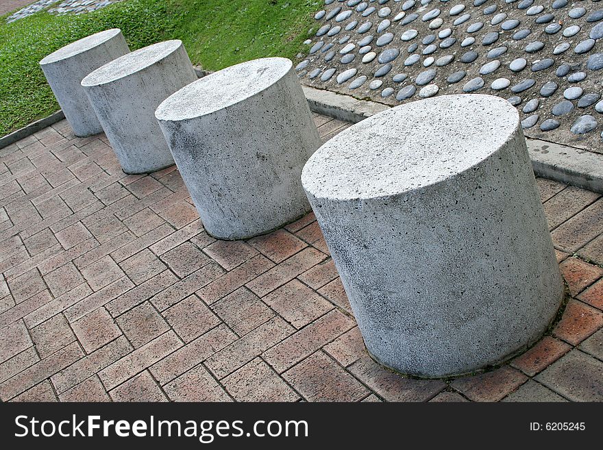 Stone stools in park for resting. Stone stools in park for resting