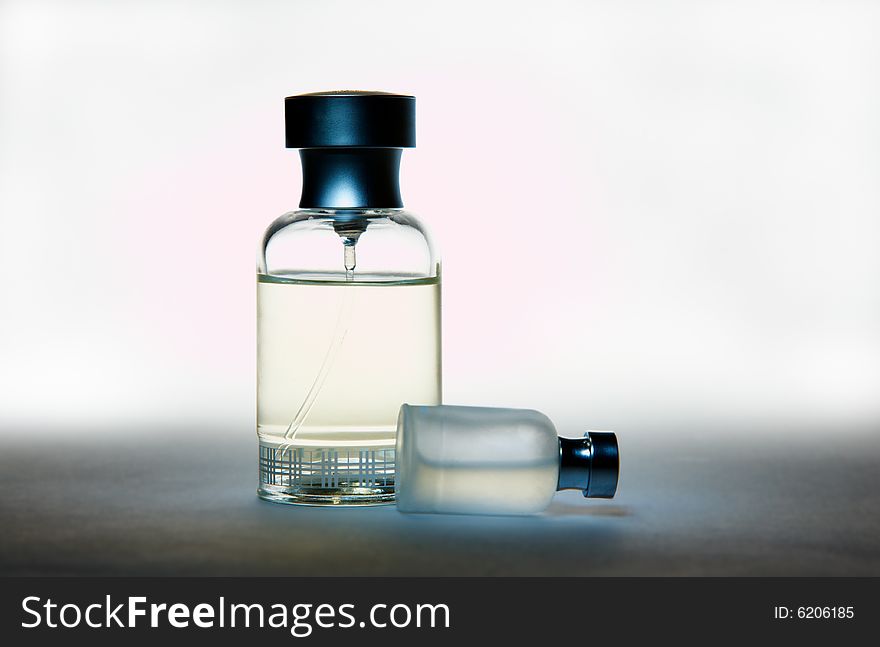 Two perfume bottles, on gradient background. Two perfume bottles, on gradient background