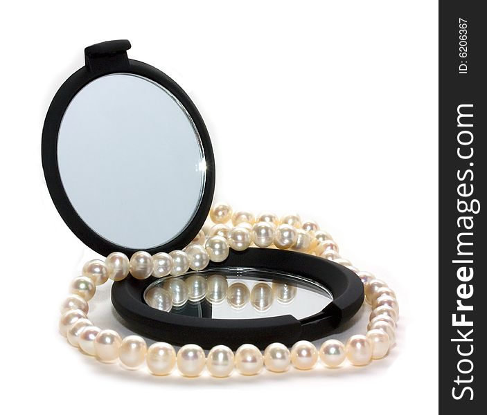 Pearl beads and black mirror. Pearl beads and black mirror