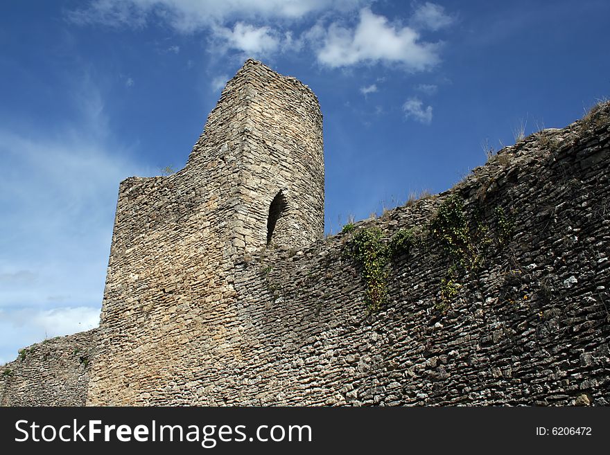 Part of the Saint-Hippolyte medieval ruins, in the town of Cremieu, France. Part of the Saint-Hippolyte medieval ruins, in the town of Cremieu, France.