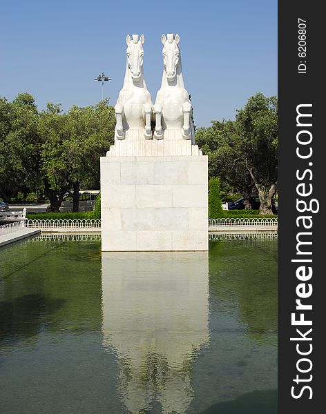 Horses statue in Jeronimos Garden lagoon, Empire Square, Belem, Portugal. Horses statue in Jeronimos Garden lagoon, Empire Square, Belem, Portugal.