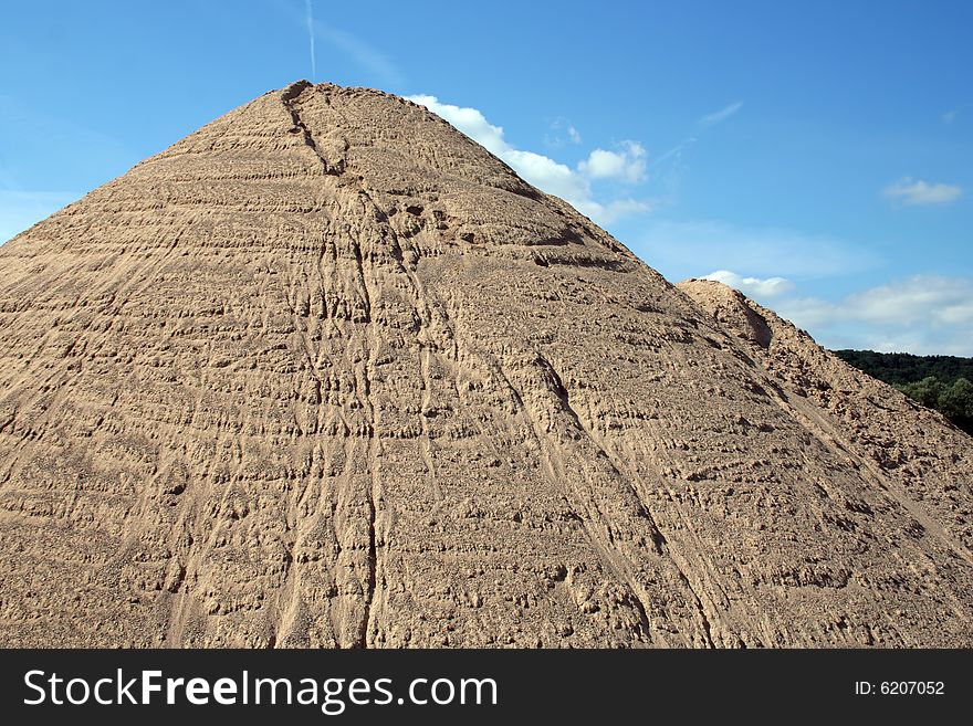 Huge mound of sand in a sand quarry.