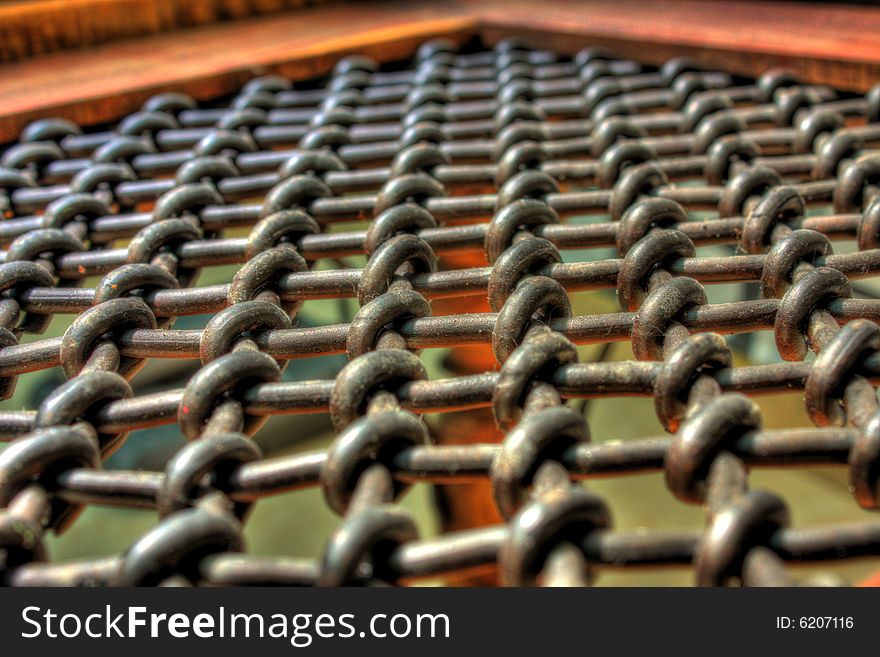 An hdr shot of an old indian styled table with chains covering it. An hdr shot of an old indian styled table with chains covering it