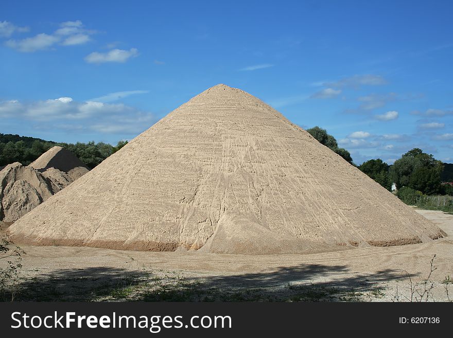 Huge mound of sand in a sand quarry.