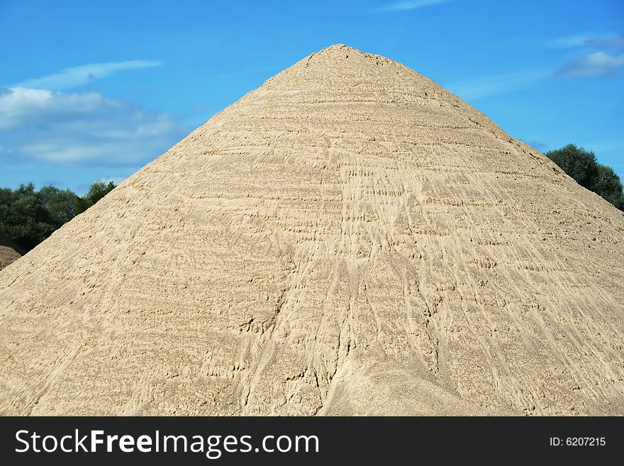 Huge mound of sand in a sand quarry.