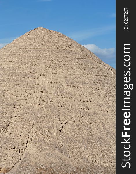 Huge mound of sand in a sand quarry.