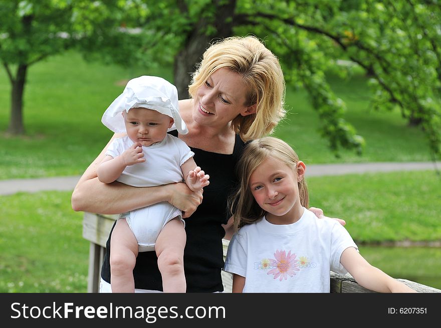 Mother and children outdoors having fun