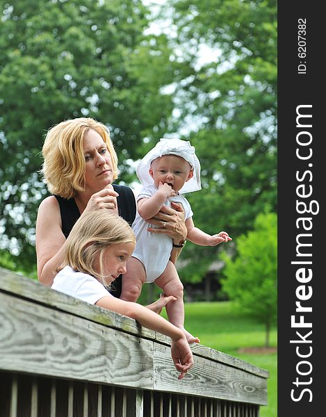 Mother and children outdoors having fun