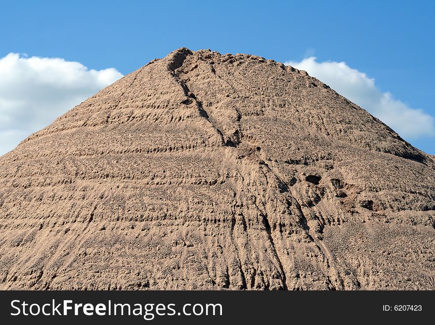 Huge mound of sand in a sand quarry.