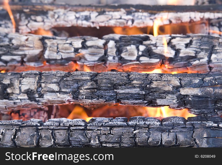 Scorched wood in flame (background)