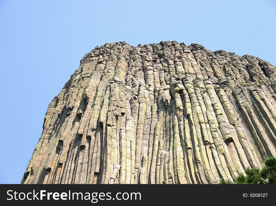 Devils tower in wyoming, native americans thought the vertical marks were made by a giant bear claws.