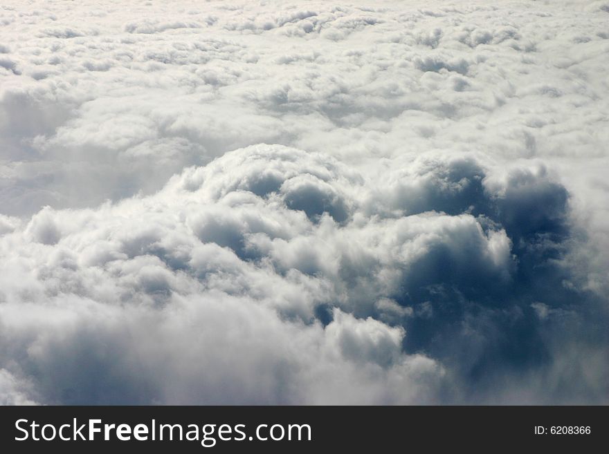 Photograph of clouds taken out of the window of an airplane