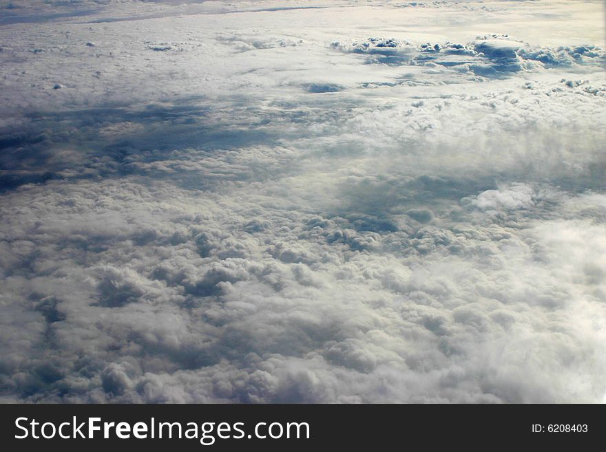Photograph of clouds taken out of the window of an airplane