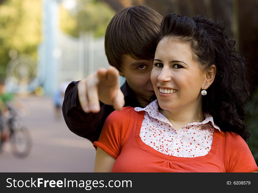 Outdoor portrait of young happy attractive couple together