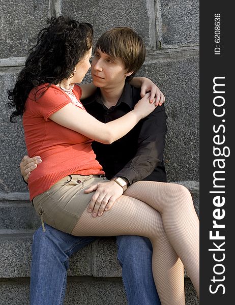 Outdoor portrait of young attractive couple together. Outdoor portrait of young attractive couple together