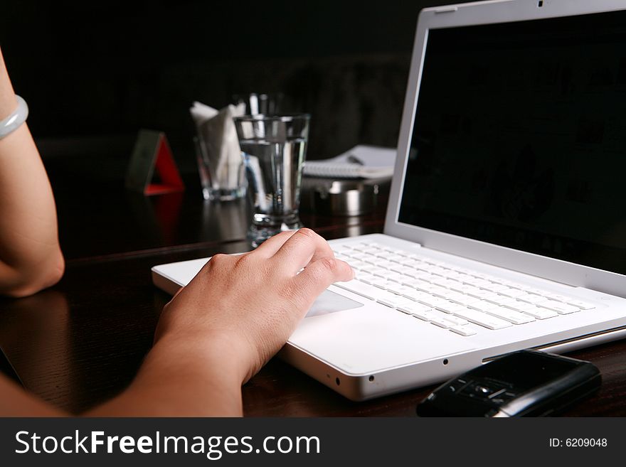 Close-up women's hand on keyboard