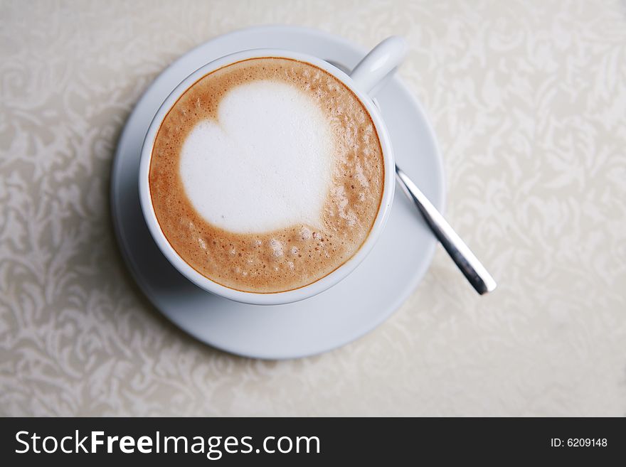 Cappuccino with heart design in foam