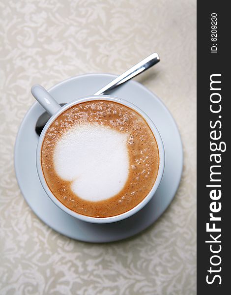 Cappuccino with heart design in foam