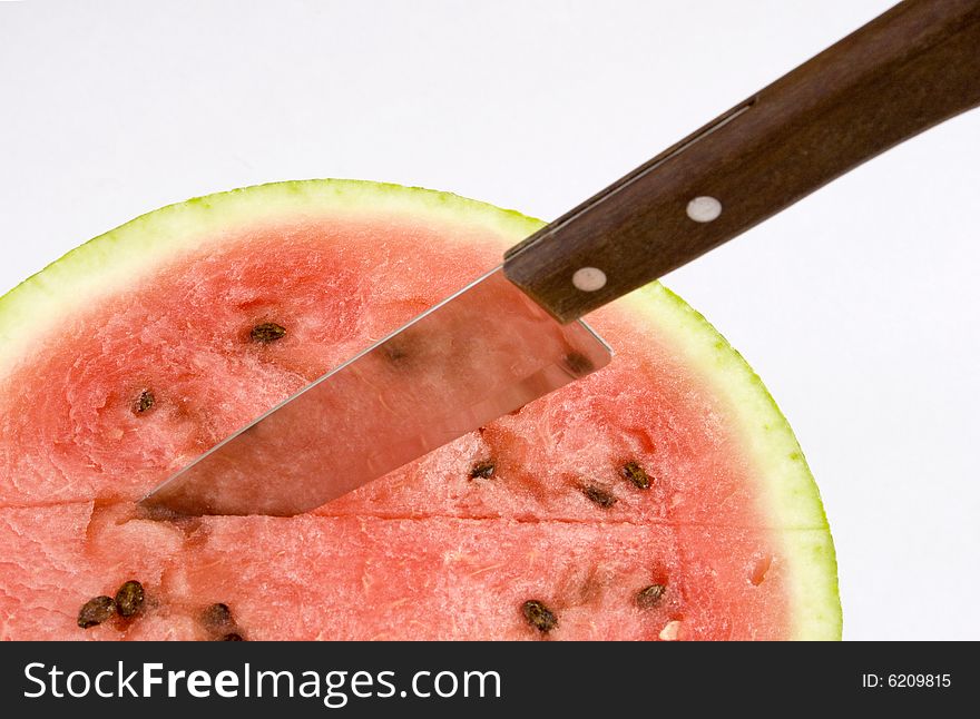 Appetizing slices of watermelon in a blue plate. Isolated on white background.