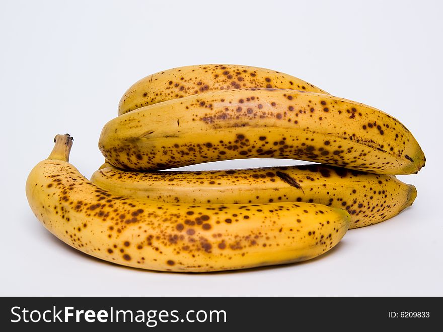 Rotten bananas on white background; addled fruits