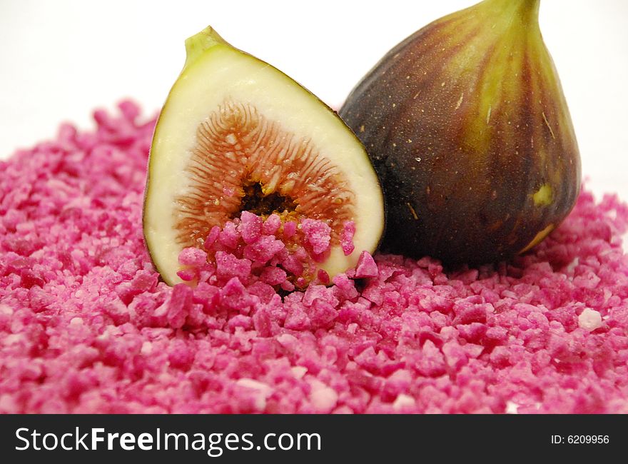 Figs on a bed of pink sugar candy. Figs on a bed of pink sugar candy