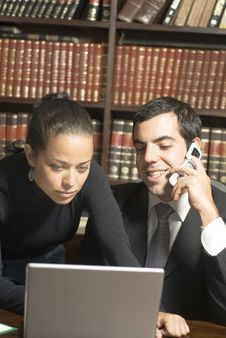 Businessman And Woman In Office - Vertical Stock Image Businessman And Woman In Office - Vertical Stock Image