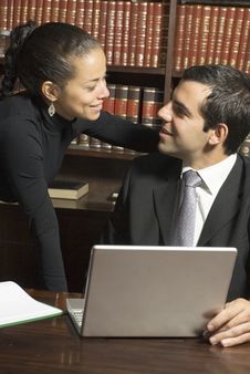 Businessman And Woman With Laptop - Vertical Royalty Free Stock Images Businessman And Woman With Laptop - Vertical Royalty Free Stock Images