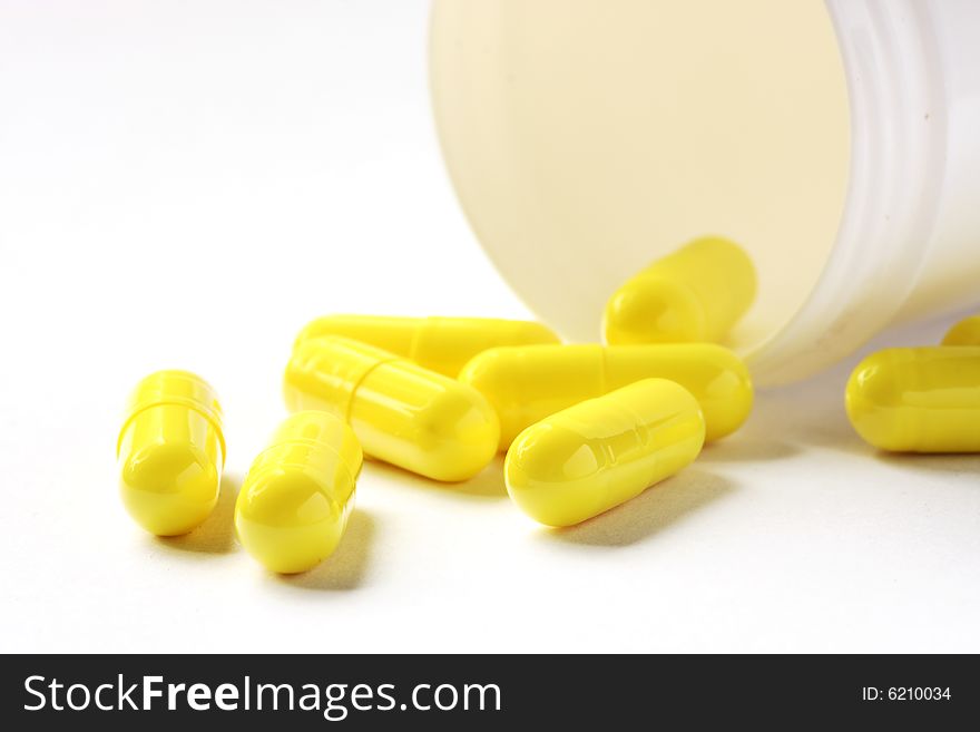 Yellow Pills And Can Isolated