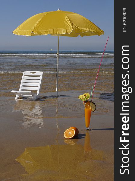 Two beach umbrellas on empty beach and bright blue ocean.Best beach. Two beach umbrellas on empty beach and bright blue ocean.Best beach