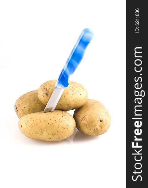 Couple of potatoes with knife isolated on white. Couple of potatoes with knife isolated on white.
