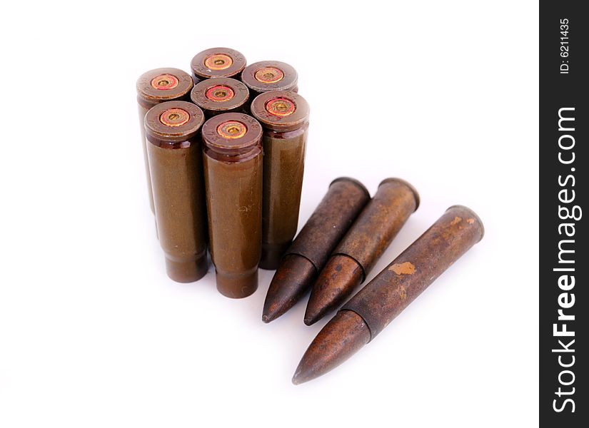 Closeup of old used 7,62 mm shells (cartriges) of AK47 and bullets of World War I isolated on white. Closeup of old used 7,62 mm shells (cartriges) of AK47 and bullets of World War I isolated on white