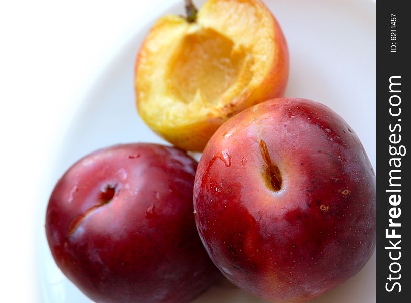 Closeup of three ripe plums