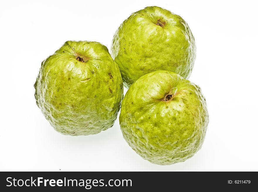 Three guavas on a white background