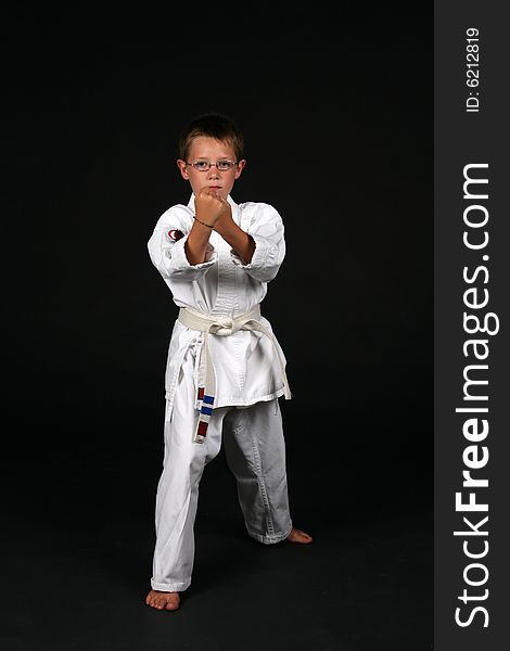 Young boy in traditional karate right stance. Young boy in traditional karate right stance