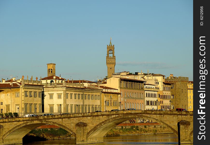 A glimpse of Florence with bridge, river and some monuments