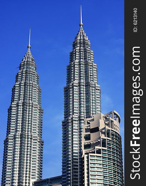Petronas Twin Towers over blue sky in Kuala Lumpur, Malaysia.